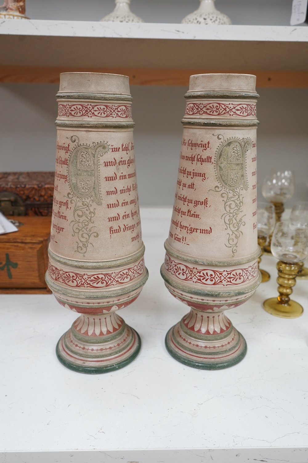 A pair of German stoneware mantel piece garniture vases, monogramed to base, 38cm high. Condition - fair